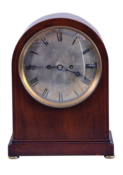 Winterhalder & Hofmeier, Schwarzenbach, Germany, 8 day double fusee Westminster chime movement in a rounded Gothic style case on bun feet, with round silvered brass dial showing Roman numerals, c1900.