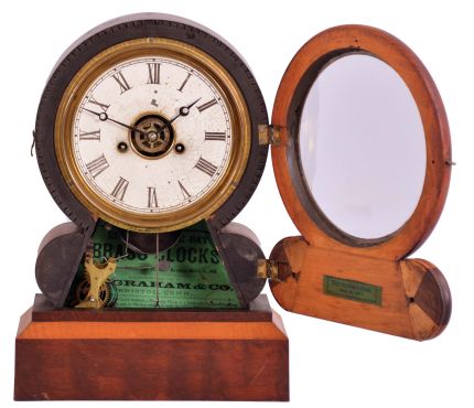 E. Ingraham & Co., Bristol, Conn., "Grecian Mosaic" shelf clock with a spring driven 30 hour time, strike and alarm movement in a walnut and maple case.