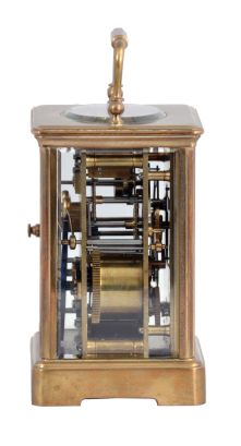 France, for Shreve, Crump & Low, Boston, striking carriage clock with alarm, brass Corniche case with beveled glasses, Arabic numeral white enamel dial with gilt mask, and subsidiary alarm chapter, blued steel distaff style hands, 8 day striking movement with lever platform, sounding the hour and half hour in passing