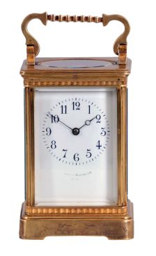 France, for Bigelow, Kennard, & Co., Boston, striking carriage clock, the gilt Corniche variant case with narrow fluted band above base and below cornice, Arabic numeral white enamel dial, blued steel Breguet style hands, 8 day striking movement with lever platform, sounding the hour and half hour in passing