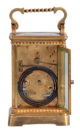 France, for Bigelow, Kennard, & Co., Boston, striking carriage clock, the gilt Corniche variant case with narrow fluted band above base and below cornice, Arabic numeral white enamel dial, blued steel Breguet style hands, 8 day striking movement with lever platform, sounding the hour and half hour in passing