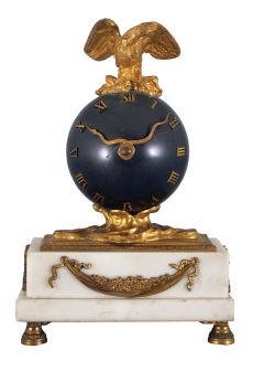 French mantel clock, 8 day, time only spring driven movement balance wheel movement on a white marble base with gilt metal ornaments, patinated spherical body with applied roman numerals, hands in the form of a snake, surmounted by a gilt cast metal eagle with outstretched wings. Diminutive round movement is stamped "FRENCH MAKE".