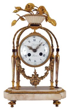 French: Merra, Paris, mantel clock, 8 day, time and strike, count wheel and bell movement with silk thread suspension by Vincenti & Cie., Paris. White marble case with gilt hardware, fluted columns and twisted arched supports, the top with large gilt roses in bloom. Signed white porcelain dial with Roman numerals.