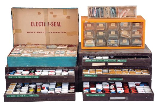 Lot of watch material, five drawer stacking cabinet with balances complete, makers including A. Schild, Seiko, Wittnauer, Eta, Gruen, Vulcain, FHF, Felsa, Unitas, Peseux, and others, one drawer with mainsprings, and a selection of balance staffs, together with an assortment of plastic watch crystals, and a small number of glass crystals, 5 drawer cabinet dimensions listed