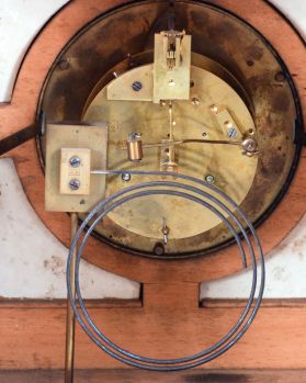 French, oak cased mantel clock with blue and white inserts and dial, 8 day, time and strike, with a movement stamped "C. J. & Co.", the case with turned corner columns and finials.