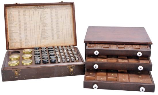 Watchmakers storage cabinets, the first an interesting, three drawer in walnut with porcelain pulls, the interior with sliding compartment covers, the top of each drawer marked Pat. March 2 1875, the other originally containing Elgin ordnance wrist watch repair material, some bottles containing parts from the original assortment, some empty or containing other material, dimensions of 3 drawer cabinet listed