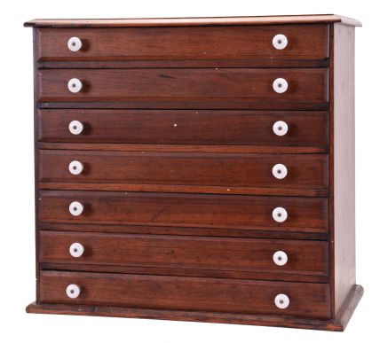 Watchmakers 7 drawer crystal cabinet in walnut with porcelain knobs, containing open face and hunting case crystals ranging in size from15 - 21