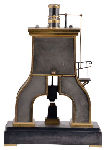 France, (Guilmet) industrial series "steam hammer", polished and patinated bronze case on a black slate base with polished feet, the hammer forming part of the complex pendulum, rising and falling, appearing to strike the anvil as the clock runs, Roman numeral metal dial, 8 day, time and strike pendule de Paris movement, with Guilmets modifications, and also with Guilmet