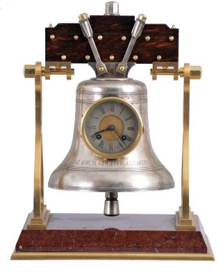 France, industrial series "Church Bell", gilt trimmed griotte marble base below stylized A shaped frames supporting the silver bell with oak headstock, all hardware in silvered or gilt finish, the bell front engraved "VAE. MIHI. SI. NON. EVANGELISAVERO" below the Roman numeral silvered dial, blued steel hands, 8 day, time and strike movement with lever platform