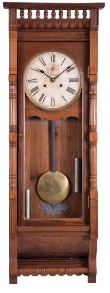 Ansonia Clock Co., New York, NY, "Santa Fe" wall hanging clock with a double weight driven timepiece movement in a walnut case.