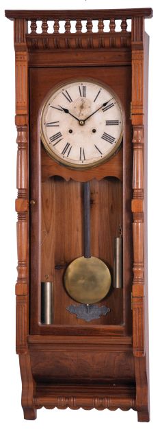 Ansonia Clock Co., New York, NY, "Santa Fe" wall hanging clock with a double weight driven timepiece movement in a walnut case.