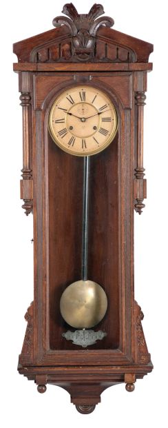 Ansonia Clock Co., New York, NY, "Bagdad" wall hanging clock with a spring driven, 8 day double wind timepiece movement in an oak case.