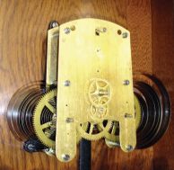 Seth Thomas Clock Co., Thomaston, Conn., "Office 30 Day - Variant" wall hanging clock with a spring driven 30 day timepiece movement in an "old oak" case.