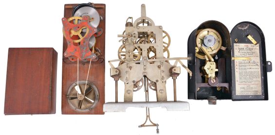 Spring-Driven Devices- 7 (Seven): items in this lot include a spring-driven fan in wood box, street clock movement with steel plates, Tork time switch, a large spring-driven motor possibly for an alarm, two time recorder movements, and an unusual long-duration movement inside of a metal canister with carrying handle.