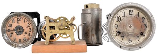 Spring-Driven Devices- 7 (Seven): items in this lot include a spring-driven fan in wood box, street clock movement with steel plates, Tork time switch, a large spring-driven motor possibly for an alarm, two time recorder movements, and an unusual long-duration movement inside of a metal canister with carrying handle.