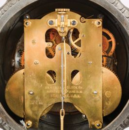 Ansonia Clock Co., New York, "Don Caesar" Figure shelf clock with a spring driven, 8 day, time and half hour strike movement with visible escapement with a black enameled iron base with a Japanese bronze spelter statue.