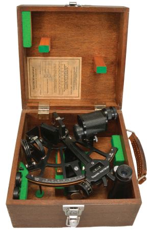 Tamaya Nautech, Japan, Model 733 sextant, 6.5 inch radius, black aluminum alloy frame with bronze arc reading 0-120, micrometer drum, multiple shades for horizon and index mirrors, 4x power and 6x power sighting scopes, battery compartment in the black plastic handle, all in finger-jointed mahogany case, serial number 37961, dated 1977.