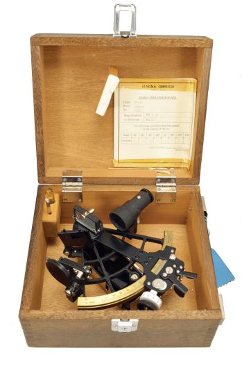Magna Corporation, Tokyo, Japan, Yamatar Model TT-701 sextant, 5 inch radius, metal frame with black crinkle finish, graduated brass arc reading 0-110, micrometer drum, dual shades for both horizon and index mirrors, 3x power sighting scope, black plastic handle, all in finger-jointed mahogany case, serial number 76583, dated 1976.