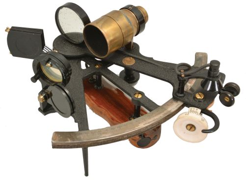 H. Hughes & Son Ltd., London, 7 inch sextant, pierced metal frame with black crinkle finish, signed brass arc with silvered scale, the graduations from -10 to 135, micrometer drum adjustment, index lamp, multiple shades for horizon and index mirrors, sighting scopes, and wood handle with battery compartment, all in finger-jointed mahogany box with a certificate from the National Physical Laboratory with a signature from its director, Sir C.G. Darwin dated 1940.