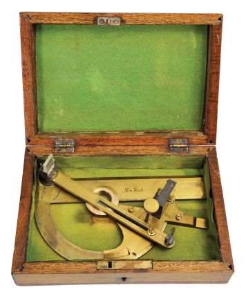 J. Prentice, New York, "Captain Douglas" reflecting circle or reflecting alidade, lacquered brass, straight-edge engraved "J. Prentice", "283", and "New York", protractor arc graduated from 0 to 130, central crosshair reticle, swinging plotting arm with vernier scale graduated from 0 to 30, sighting vane, half-silvered mirror, and index reflector, all in a felt-lined wooden case. This instrument is named after its inventor, Sir Howard Douglas, renowned British military engineer.