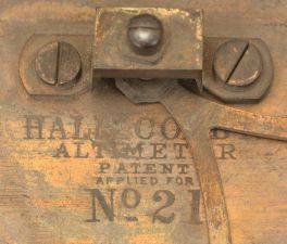 Hall Colby, New York, "Altimeter" or gravity sextant, lacquered brass, 9.5 inch sighting tube atop a graduated brass arc reading 90 to 0 to 90. Center of arc reads "HALL COLBY / ALTIMETER / Patent Applied For / No. 21". Two vernier scales, one for the "ALTITUDE" scale showing degrees from a horizontal axis and one for the "ZENITH" scale showing degrees from a vertical axis. Free-swinging pendulum establishes a vertical line of reference against which the angles are measured. Spring-loaded pin locks pendulum when a reading has been made.