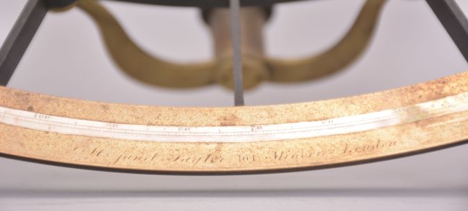 Janet Taylor, London, 7.5 inch radius, black metal ladder frame, brass arc signed Mrs. Janet Taylor, 104 Minories, London" with inset silver scale with graduations reading -5 to 150, tangent screw vernier adjustment, index magnifier, sighting telescopes, multiple sun shades for index and horizon mirrors, ebony handle, all in a felt-lined dovetailed mahogany box with accessories.
