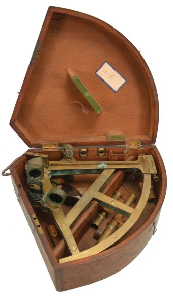 Edward Troughton, London, double or pillar frame brass sextant, 10 inch radius, twin brass frames engraved "No. 93" connected by pillars, large graduated arc measuring 13.75 inches across reading "Troughton- London" and divided from -5 to 155, knurled tangent screw for vernier adjustment, four index and horizon mirror shades, three telescopes, walnut handle, all in a keystone-shaped dovetailed wooden box with later retailer label.