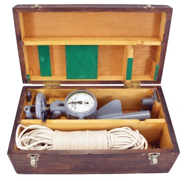 T.S. & J.D. Negus, New York, "Negus Taffrail Log", gray painted metal body with white enamel dial reading to 100 and subsidiary dial reading to 10, metal rotor, mounting shoes, rope, and other accessories, all in a fitted wood box, patented 1892.