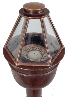E.S. Ritchie & Sons Inc., Boston, Mass., brass binnacle, 5 inch liquid-filled compass signed "Negus" on gimballed mount covered by a hexagonal glazed brass case, two of the glasses with vertical sight lines, all on a cylindrical brass stand with flange base.