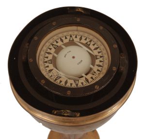 E.S. Ritchie & Sons Inc., Boston, Mass., brass binnacle, 5 inch liquid-filled compass signed "Negus" on gimballed mount covered by a hexagonal glazed brass case, two of the glasses with vertical sight lines, all on a cylindrical brass stand with flange base.