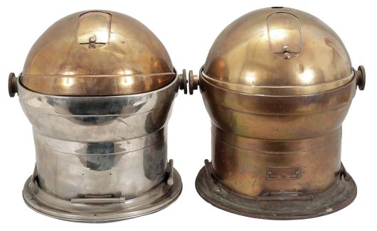 Instruments- 2 (Two) Brass Binnacles: John E. Hand, Philadelphia, gimbal-mounted 6.5 inch wet-card compasses within heavy brass bases, one nickel plated, dome tops with knurled hand screws and sliding doors to cover viewing port, both electrically illuminated.