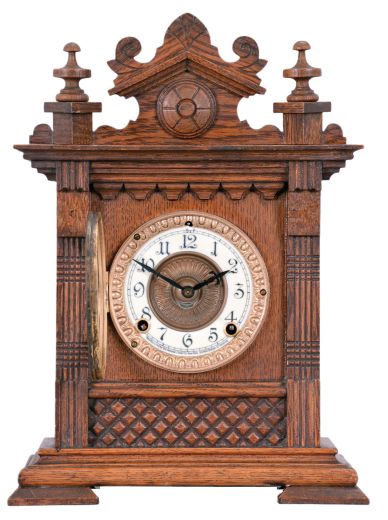Ansonia Clock Co., New York, "Salem" cabinet shelf clock with a spring driven, 8 day, time and half hour strike movement in an oak case.
