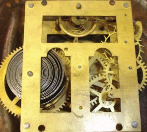 Bradley & Hubbard, Meriden, Conn., "Topsey" blinking eye shelf clock with a spring driven, 30 hour, timepiece with a balance wheel escapement in a painted cast iron case.