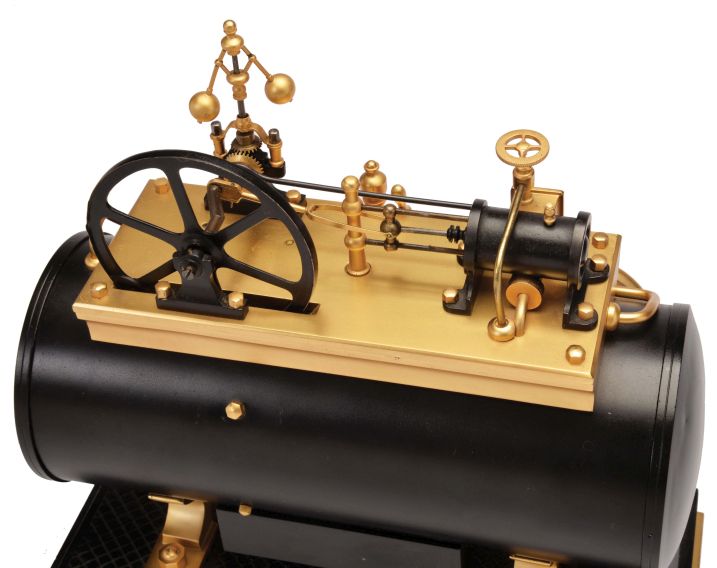 France, a rare, gilt and patinated, automated steam engine compendium, the horizontal boiler mounted to a cast floor with crosshatched surface, and resting on a black slate base, boiler fitted with an 8 day, timepiece and aneroid barometer, both with silvered dials and flanking the central thermometer with silvered scale, and surmounted by the engine flywheel, governor, cylinder and valve, the flywheel, piston, and governor powered by a movement concealed in the cylinder, the motion started and stopped through the screw in the cylinder valve, the valve front with plaque marked "D. H. Depose"