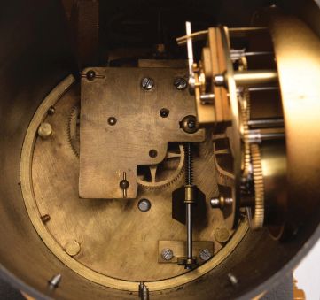 France, a rare, gilt and patinated, automated steam engine compendium, the horizontal boiler mounted to a cast floor with crosshatched surface, and resting on a black slate base, boiler fitted with an 8 day, timepiece and aneroid barometer, both with silvered dials and flanking the central thermometer with silvered scale, and surmounted by the engine flywheel, governor, cylinder and valve, the flywheel, piston, and governor powered by a movement concealed in the cylinder, the motion started and stopped through the screw in the cylinder valve, the valve front with plaque marked "D. H. Depose"