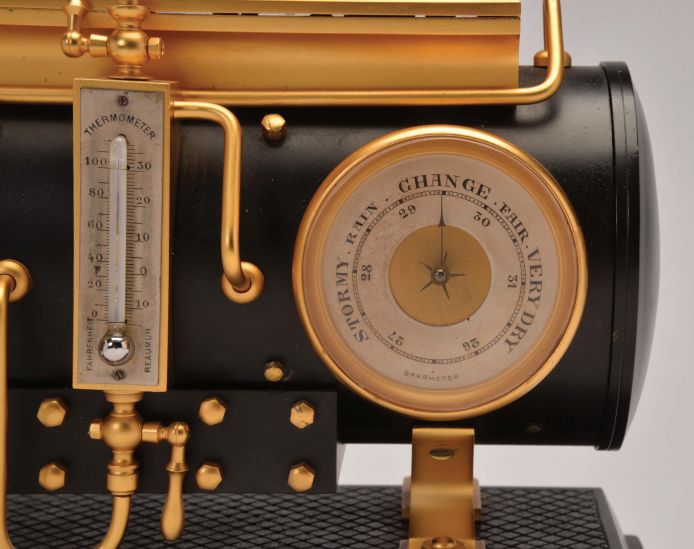 France, a rare, gilt and patinated, automated steam engine compendium, the horizontal boiler mounted to a cast floor with crosshatched surface, and resting on a black slate base, boiler fitted with an 8 day, timepiece and aneroid barometer, both with silvered dials and flanking the central thermometer with silvered scale, and surmounted by the engine flywheel, governor, cylinder and valve, the flywheel, piston, and governor powered by a movement concealed in the cylinder, the motion started and stopped through the screw in the cylinder valve, the valve front with plaque marked "D. H. Depose"