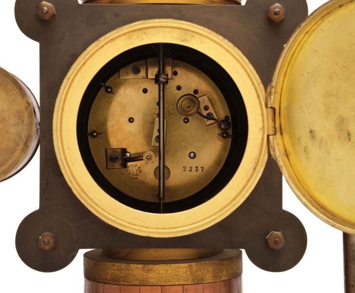 France- Andre Romain Guilmet, a rare Industrial steam boiler compendium with centrifugal governor pendulum, the stepped black slate base supporting a compass on a decorative stand, before a boiler with gilt and patinated silver surfaces and ribbed, copper base matching the clock case, the top having a cylindrical chamber with vent pipes attached to gauge form, flanking, white dialed thermometer and barometer, and concealing the helical suspension spring controlling the centrifugal governor form pendulum, Arabic numeral gilt dial, blued steel distaff hands, and 8 day pendule de Paris time and strike movement with Guilmet