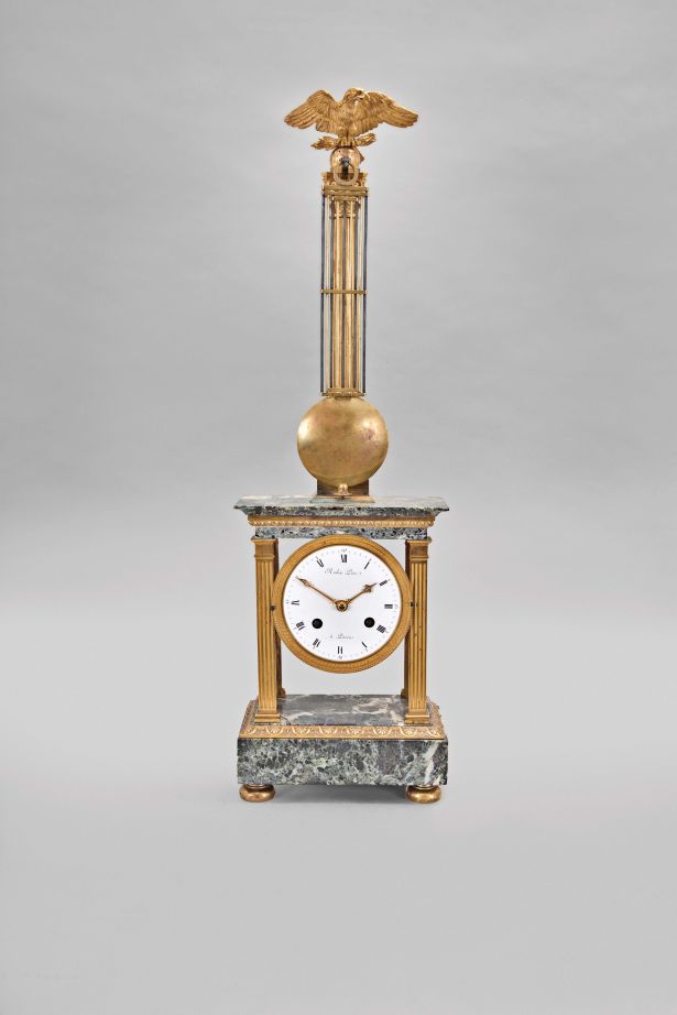 Robin Pere, a Paris, a marble and gilt bronze mystery clock, the variegated, green marble, portico style case with fluted pilasters flanking the dial, and supporting the entablature, surmounted by a gilt column with eagle finial, with knife edge stud for suspending the gridiron pendulum, signed, Roman numeral white enamel dial with pierced and engraved gilt hands, 8 day, two train movement striking the hours and half hour in passing,