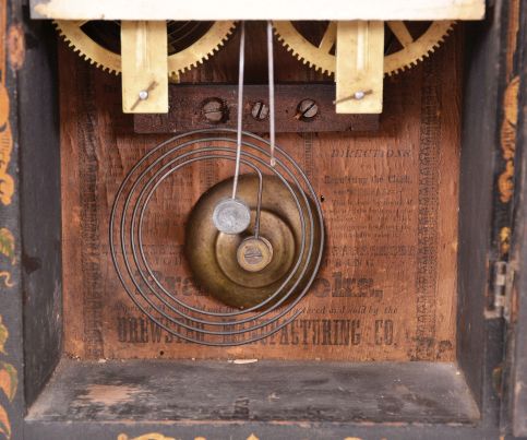 Brewster Manufacturing Co., Bristol, Conn., 8 day, time and strike, spring brass movement serpentine front shelf clock with gilt decoration.