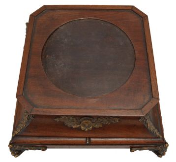 A. Cadot, Place Dauphine, Paris, a mahogany, gilt bronze mounted, floating turtle mystery clock, the case with square base on cast scroll feet, the upper portion with incurved sides with bronze mounts and molded top, supporting a water filled pewter bowl, the rim with engraved roman numerals, and arabic 15 minute markers, the turtle floating, and indicating the time, driven by a magnetic ring attached to the timepiece movement with lever platform concealed in the base, the back plate signed Samuel Marti, the front with Cadot