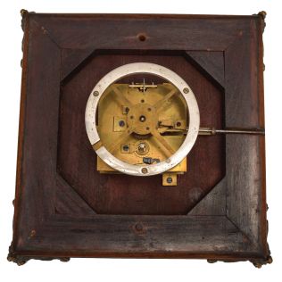 A. Cadot, Place Dauphine, Paris, a mahogany, gilt bronze mounted, floating turtle mystery clock, the case with square base on cast scroll feet, the upper portion with incurved sides with bronze mounts and molded top, supporting a water filled pewter bowl, the rim with engraved roman numerals, and arabic 15 minute markers, the turtle floating, and indicating the time, driven by a magnetic ring attached to the timepiece movement with lever platform concealed in the base, the back plate signed Samuel Marti, the front with Cadot