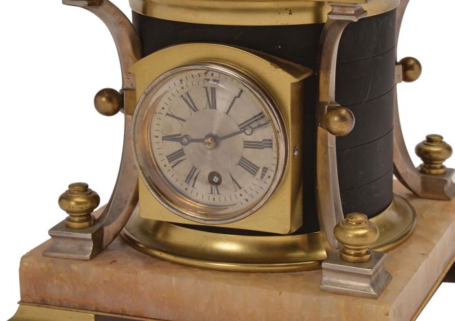 France, possibly Andre Romain Guilmet, a rare, automated, oscillating cylinder steam engine timepiece, the honey onyx square base on gilt feet, and supporting the black bronze boiler with cove molded top and bottom, below the engine itself, comprised of a large, A frame supported, spoked flywheel, connected to a rocking cylinder through a cranked linkage, the movement powering the automation contained in a black enclosure behind the engine, the enclosure top with a rotating governor in a bell shaped frame behind the wheel, surrounded by four silvered columns, and surmounted by an X shaped, arched frame with central spherical finial, the 11 jewel lever platform movement with Roman numeral silvered dial and blued steel Breguet style hands