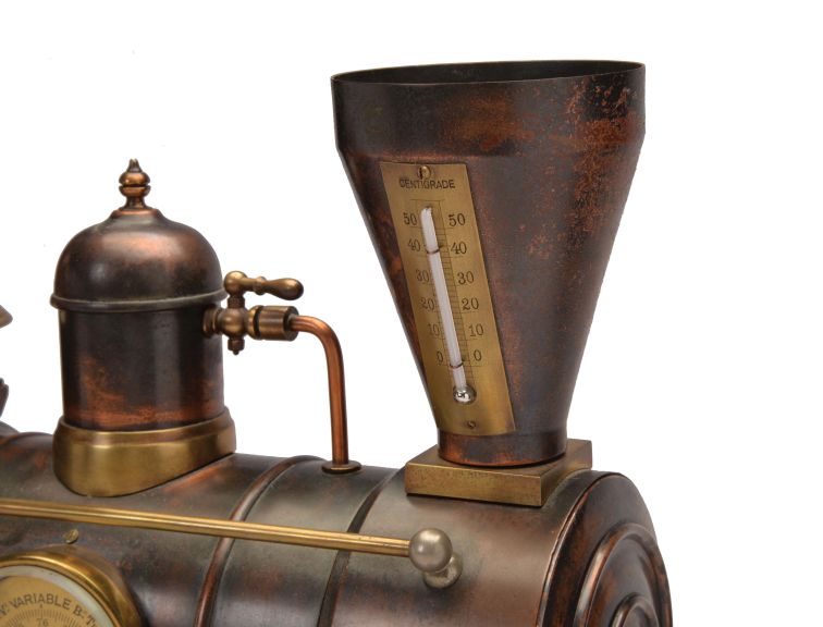 France, a rare, automated, patinated bronze locomotive form compendium, the stepped, black slate base on gilt feet with patinated rails below the large, steam locomotive, the darker surfaces highlighting the nickel, brass, and copper appointments, the engine front with cow catcher, the boiler with aneroid barometer, bell, steam dome with valve and flared stack with centigrade thermometer, the cab with shallow pitched roof, slender columns at the corners, and containing the clock and dial, a concealed movement in the base providing power to drive the six wheels, connecting rods, and piston, roman numeral brass dial, blued steel Breguet style hands, and 8 day, two train pendule de Paris movement