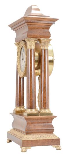 France, portico clock, 8 day, time and strike, round spring driven movement in a figured hardwood veneer case with satinwood inlay on the front, cast leaf moldings on the base, columns, pendulum, and bezel, roman numeral silvered dial with guilloché center, blued steel Breguet style hands