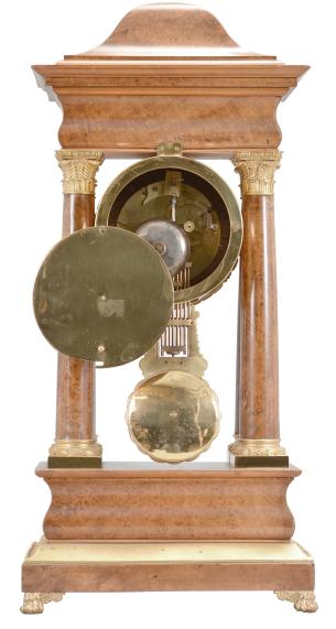France, portico clock, 8 day, time and strike, round spring driven movement in a figured hardwood veneer case with satinwood inlay on the front, cast leaf moldings on the base, columns, pendulum, and bezel, roman numeral silvered dial with guilloché center, blued steel Breguet style hands