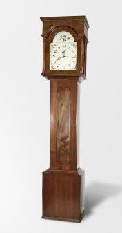 England, tall clock, 30 hour, time and strike, weight driven bell strike movement in an American-made walnut case with flat top, painted metal dial with floral elements, pierced brass hands.
