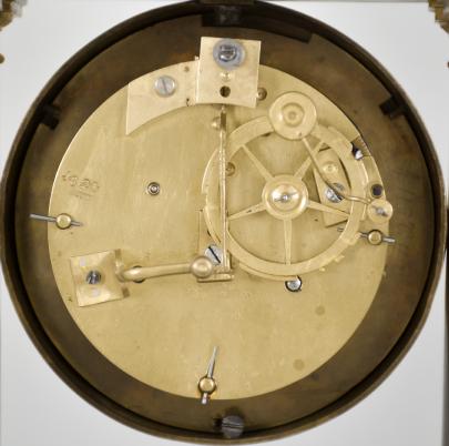 France, empire portico clock, 8 day, time and strike, spring driven brass pendule de Paris movement in a patinated brass case on cast brass feet, the base and top with applied gilt floral ornaments, four Corinthian columns with gilt bases and capitals, the gilt bezel with repeating rose-and-leaf design, roman numerals, cast dial center, pendulum with knife-edge suspension, blued steel Breguet hands, all on a painted wood base under a glass dome.
