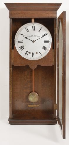 Clocks- 3 (Three): (1) National Time Recorder Co., London, England, master clock, brass movement with electrically impulsed pendulum in a mahogany case with painted metal dial, c1940; (2) Differential Power Clock Co., Chicago, "One Year Differential Power Clock" wall clock, year running, time only, driven by two springs brass movement in a robust oak case and with signed metal dial, c1910; (3) McClintock-Loomis Company, Minneapolis, Minn., master clock, 8 day, time and program mechanism, spring driven brass clock movement and second spring driven program movement in a wood case with painted copper dial, c1930.