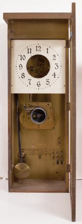 Clocks- 3 (Three): (1) National Time Recorder Co., London, England, master clock, brass movement with electrically impulsed pendulum in a mahogany case with painted metal dial, c1940; (2) Differential Power Clock Co., Chicago, "One Year Differential Power Clock" wall clock, year running, time only, driven by two springs brass movement in a robust oak case and with signed metal dial, c1910; (3) McClintock-Loomis Company, Minneapolis, Minn., master clock, 8 day, time and program mechanism, spring driven brass clock movement and second spring driven program movement in a wood case with painted copper dial, c1930.