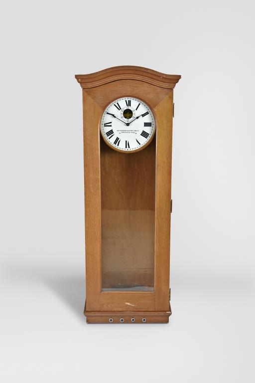 Clocks- 2 (Two) master: (1) Standard Electric Time Co., Springfield, Mass., master clock, time only, electrically driven brass movement in an oak case with a heavy nickel plated pendulum bob and silvered metal dial with subsidiary seconds and movement viewing aperture, c1920 (2) Standard Electric Time Co., Springfield, Mass., master clock, time only, electrically driven brass movement in an oak case with painted metal dial with subsidiary seconds and movement viewing aperture, c1930.